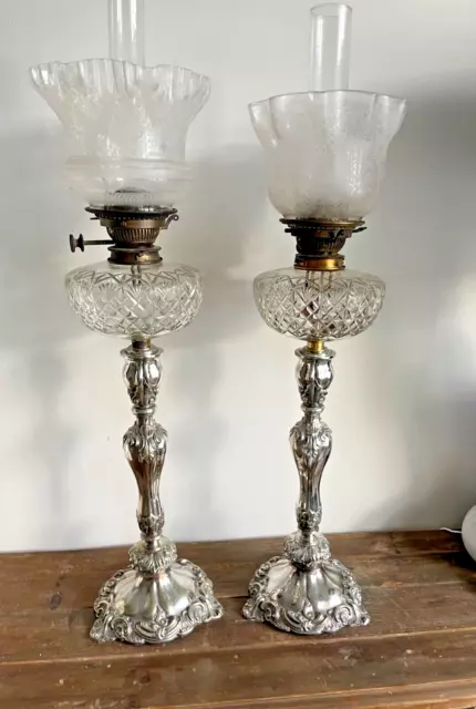 pair of large ornate silver plate oil lamps cut glass fonts & acid etched shades