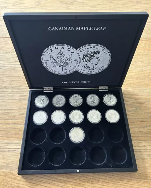 Très belle collection de monnaie 1 once Maple Leaf 11 Pièces Dans Son Coffret .