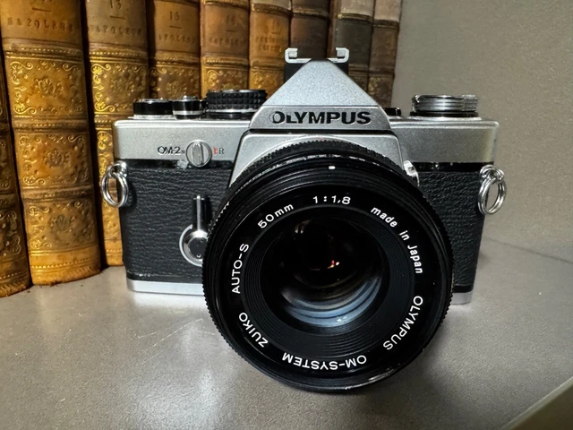 OLYMPUS OM-2N + 50mm F1.8 LENS in WORKING ORDER BUT GRUBBY