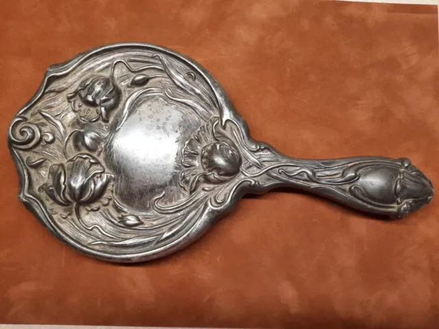 Art Nouveau Hand Held Silver Mirror With Flowers. Not Marked Sterling so plated?