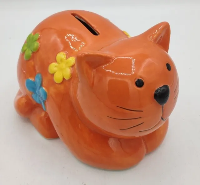 Orange Cat Bank With Colorful Flowers