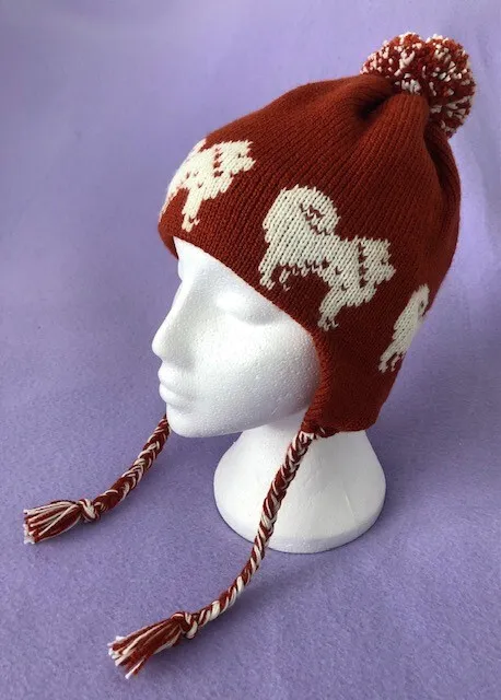 CREAM CHOW CHOW DOG on RUST KNITTED ADULT SIZE TRAPPER / EAR FLAP HAT.
