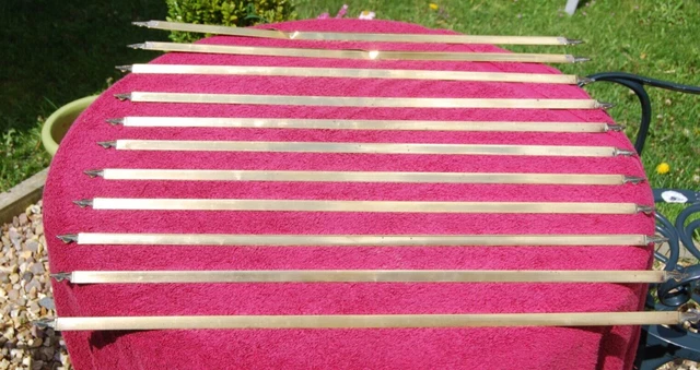 11 folded brass triangular section stair carpet rods total length 69cm