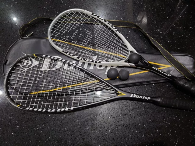 Two Dunlop Squash Rackets, Some Balls And A Case