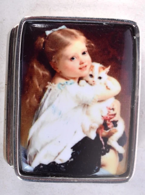 Silver & Enamel Pill Box With The Lid Decorated With A Young Girl With Cat