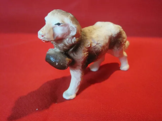 Vintage ceramic St. Bernard dog figurine with rescue barrel