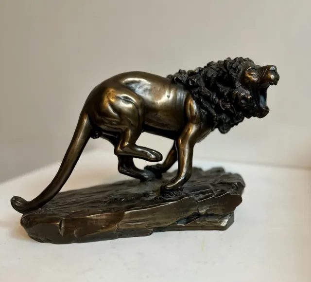 Angry bronze Lion sculpture in attack mode