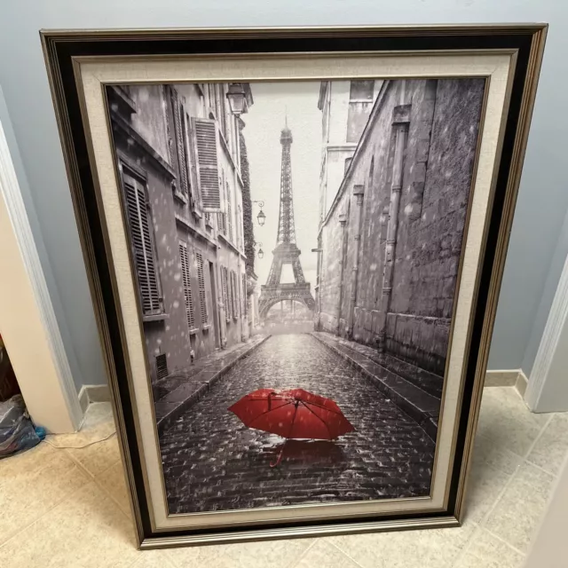 Red Umbrella In Center Of Street In Paris Rain. Eiffel Tower