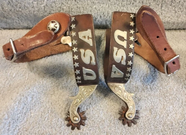 A Pair of Cowboy/Cowgirl USA Western Decorative Spurs Wtih Leather Straps