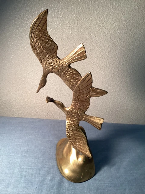 vintage solid brass flying sea birds with fish. (bin b3)