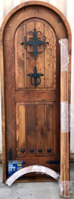 Rustic reclaimed lumber arched door solid wood storybook castle winery speakeasy