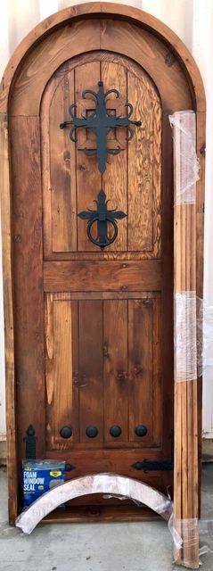 Rustic reclaimed lumber arched door solid wood storybook castle winery speakeasy
