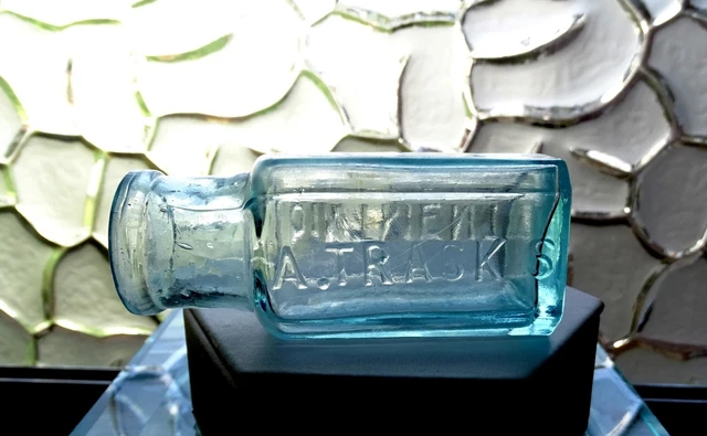 A Trasks Magnetic Ointment 3 3/8" Antique Aqua Glass Bottle D Ransom NY 1846-60
