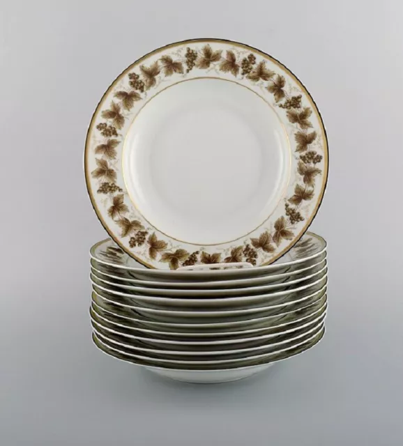 12 Limoges porcelain deep plates with hand-painted grape vines. 1930'/40's