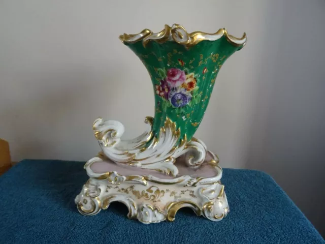 Large continental cornucopia type vase on rococo base