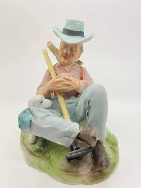 Capo di monte style figurine of a man resting with a Hoe statue Ornament