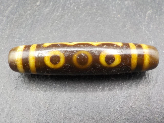 An Agate Dzi bead with a 5 Eye pattern from Tibet / Nepal.