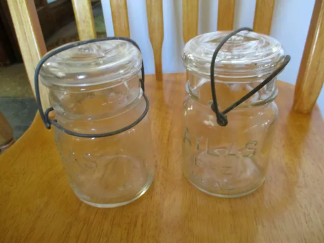 2 Atlas Clear pint size canning jars & wire bale regular type glass clear lids