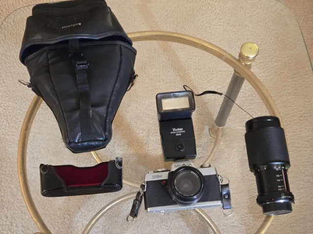 Minolta XG-1  35mm Camera with Camera bag and Several Accessories