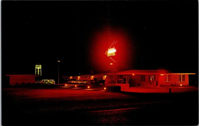 Taft TX Inland Motel Neon Lights Night View Water Tower Wagon postcard FQ2