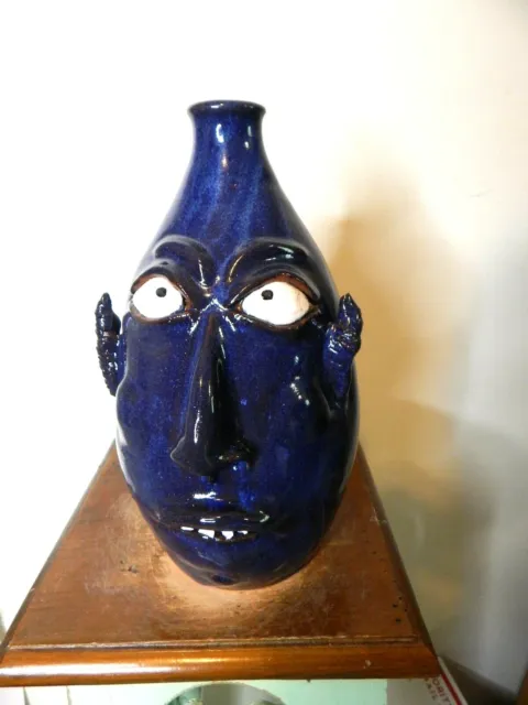 wayne hewell   face jug, pottery, folk art  10''x 7''