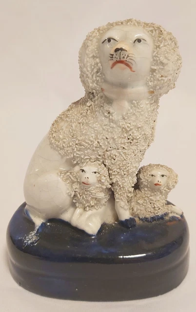 mid 19th century staffordshire poodle dog with puppies , made in England 1800's