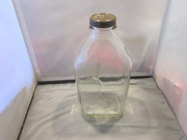 https://www.picclickimg.com/Ek8AAOSwNuxj2o-J/Stanpac-Clear-Glass-1-2-Gallon-Milk-Bottle-Jar.webp