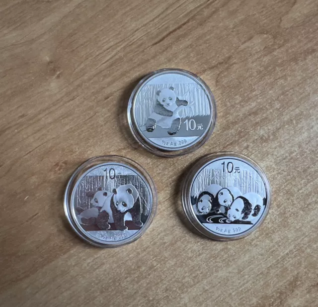 1 oz silver panda coins. Three Coins 2010, 2013 and 2014.