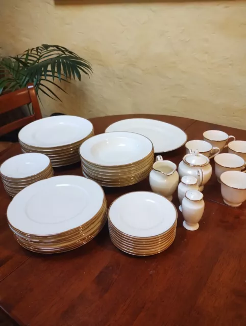 RC by Noritake, 53 piece dinnerware set, excellent cond pattern #111: gold rim