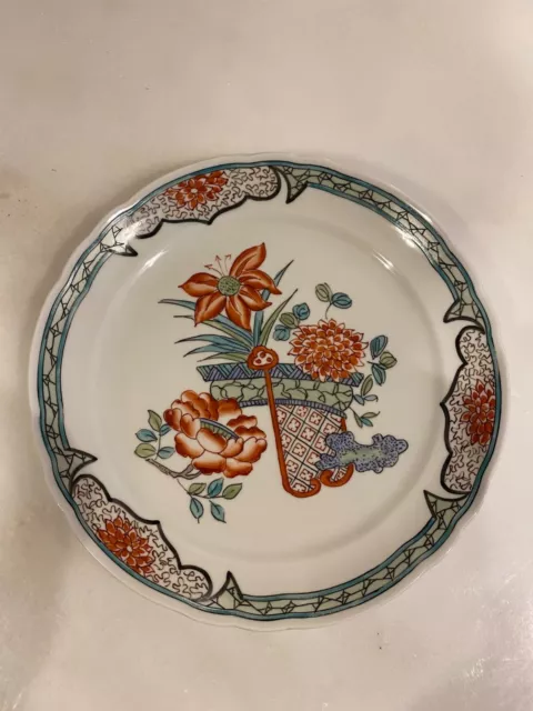 Assiette en porcelaine de LIMOGES signée JG