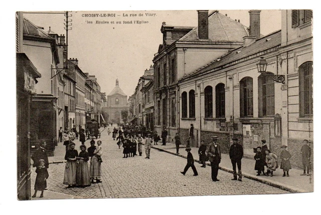 Cpa 94 Choisy-le-Roi. Rue de Vitry. Les Ecoles et l’Eglise. Très animée. Dos div