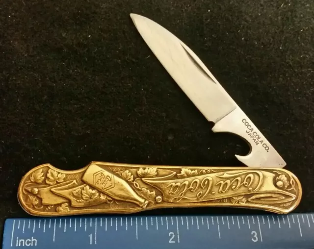 Coca-Cola Co. Novelty knife, brass handles, Japan  =
