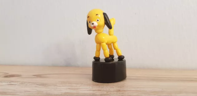 Juguete de marioneta vintage con botón pulsador amarillo y negro plegable para perro