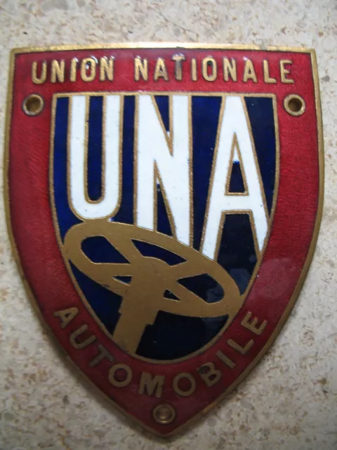 Plaque émaillée de calandre marquée U.N.A -UNION NATIONALE AUTOMOBILE mascotte