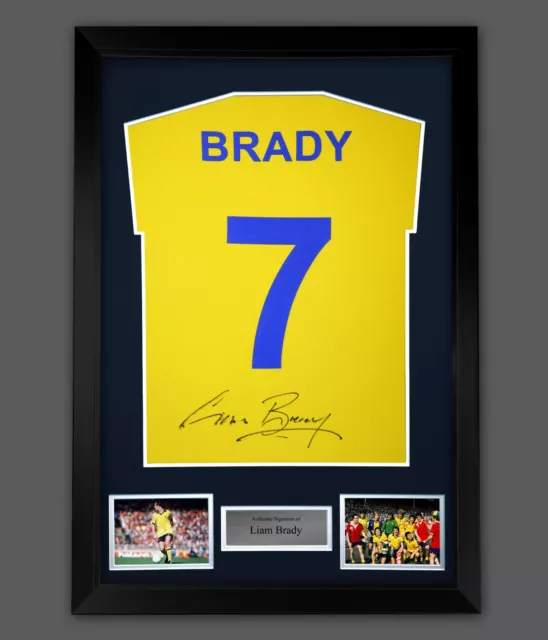 Liam Brady Signed Yellow Player T-Shirt  Framed Presentation. Arsenal Legend