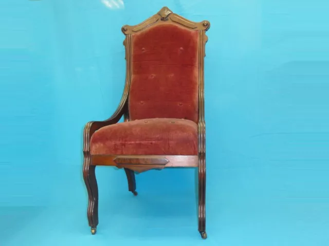 ANTIQUE VICTORIAN 19 .c RED VELVET EASTLAKE TUFTED CHAIR with BRASS ROLLERS