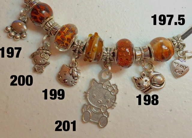 Pick a charm: DOG CAT PAW BOY GIRL BICYCLE MOTORCYCLE SKATE TRAIN BI-PLANE