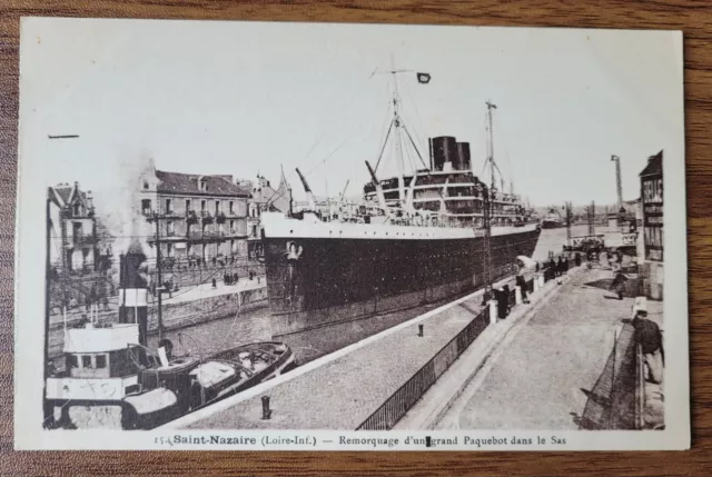 Saint Nazaire - Towing a Large Liner through the Lock.  Vintage Postcard.