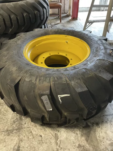 19.5-24 10-Ply R4 Titan Tire/Wheel Assy on NH Yellow Wheel, Left Assy.