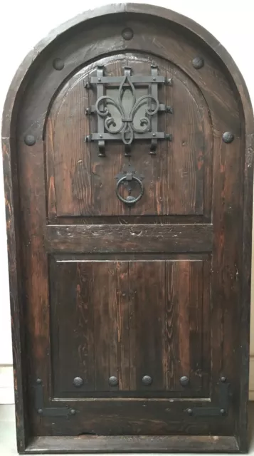 Rustic reclaimed lumber arched door solid wood storybook castle winery speakeasy