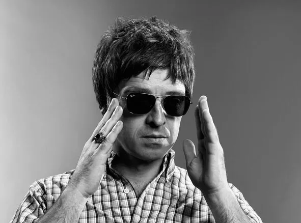 Oasis Unsigned photo - Noel Gallagher - Donation to Cancer Charity *10