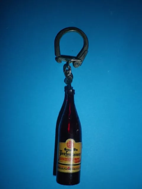 ancien porte clé bourbon, bouteille grand vin préfontaines