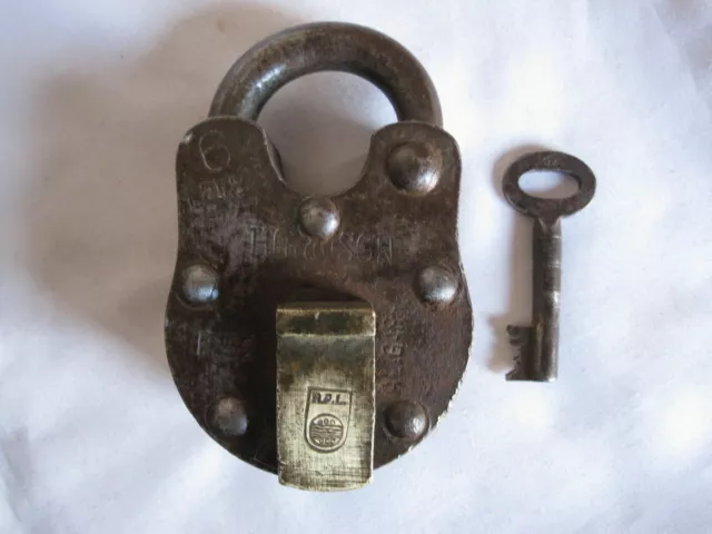 Iron Padlock Or Lock With Key, An Old Or Antique Trick Or Puzzle