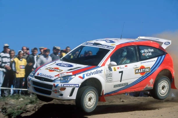 Colin McRae and Nicky Grist driving their Ford Focus WRC on a stage in