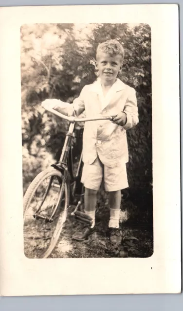 LITTLE BOY RIDING BIKE real photo postcard rppc bicycle portrait