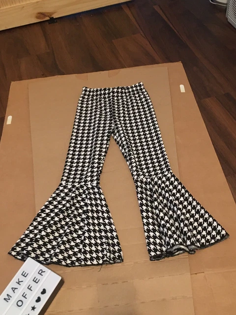 girls size 7-8 years old bell bottom leggings new never work black and white