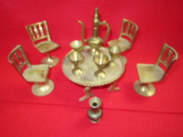 brass decorative mini table and chairs and cups and jug