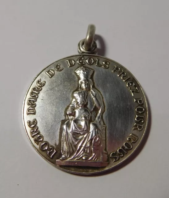 Medaille religieuse ancienne " Notre Dame de Déols " - metal argenté