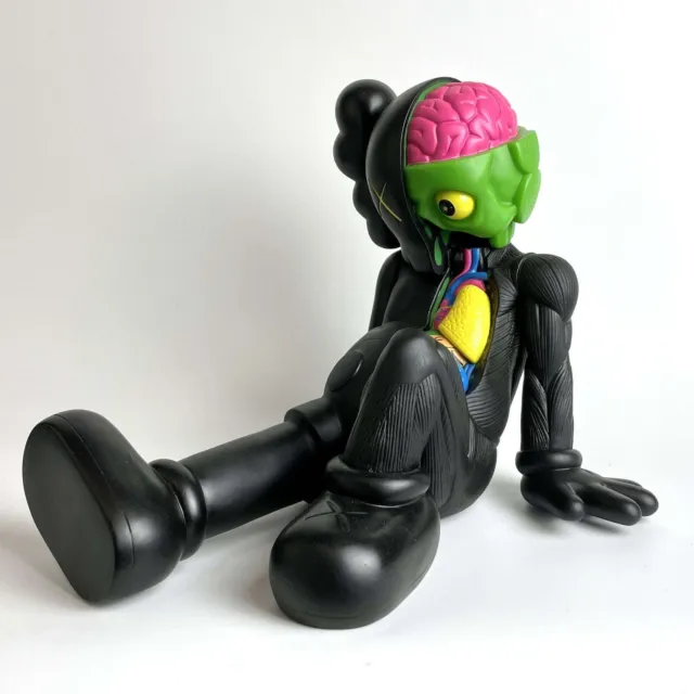 Black Sitting Kaws Figure (length: 37cm, height: 20cm)