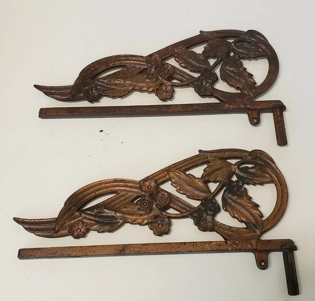 Pair of heavy duty Art Nouveau cast iron swing arm rods